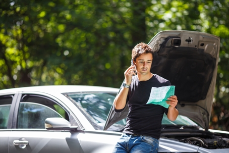Man calling an insurance after a car accident