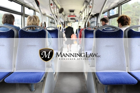 photograph of middle aisle on a bus with empty seats